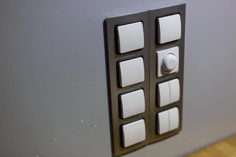 Set of modern lightswitch on grey wall. Electronic light switch. Smart home a Stock Photos