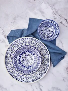 Set of modern trendy blue plates on marble background. Minimalistic Flat lay  Stock-Fotos