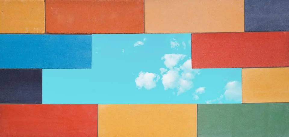 A set of the multi-colored ceramic bricks made in a wall with window for blue Stock Photos