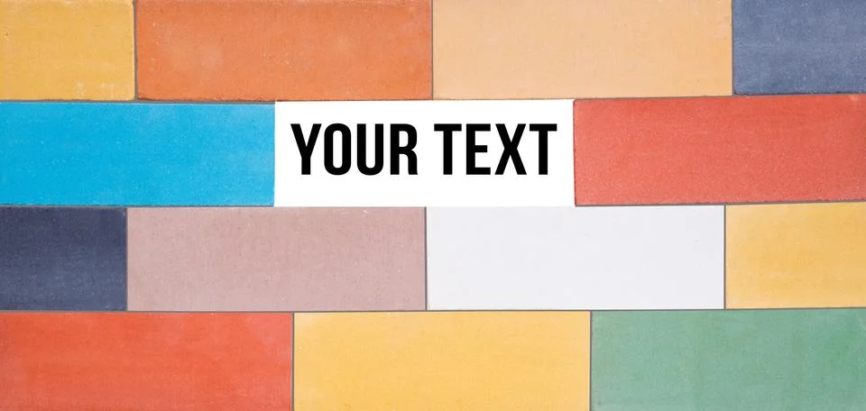 A set of the multi-colored ceramic bricks made in a wall with window for text Stockfoto's