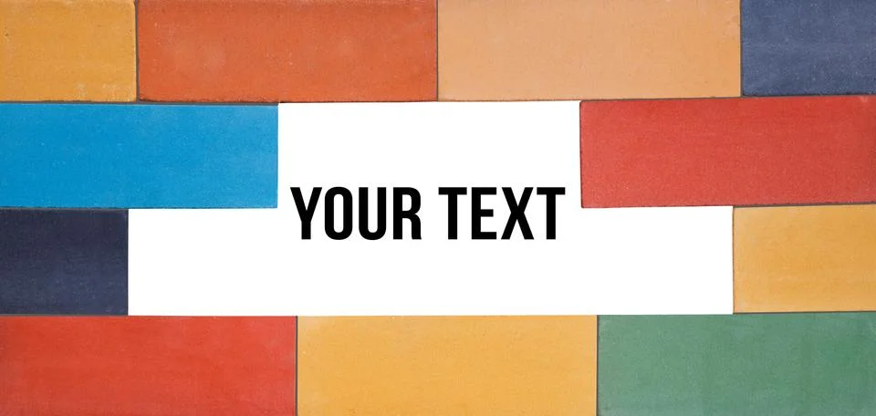 A set of the multi-colored ceramic bricks made in a wall with window for text Stockfoto's