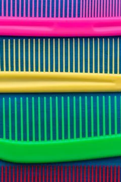 A set of multi-colored combs close-up. Vertical photography. Stock Photos