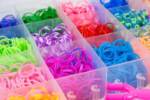 A set of multi-colored elastic bands for weaving bracelets for children. Photos