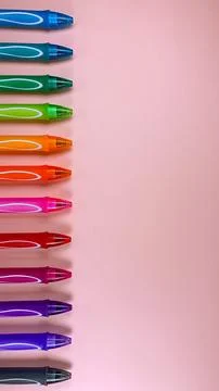 Set of multi-colored gel pens on a pink background Stock Photos