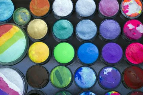 Set of multi-colored paints for drawing on the face. Stock Photos