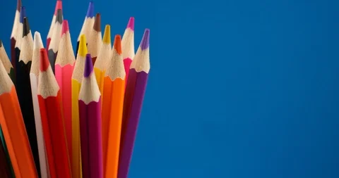 Set of multi-colored pencils rotating on a blue screen, chromakey background Stock Footage 107907796