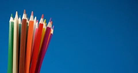 Set of multi-colored pencils rotating on a blue screen, chromakey background Stock Footage 107912564