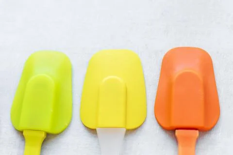 Set of multi-colored silicone spatulas, kitchen tools. Sweet pastries, recipe Stock Photos