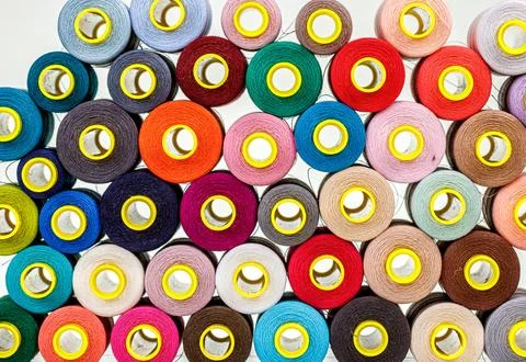 Set of multi-colored spools of thread for sewing Stock-Fotos
