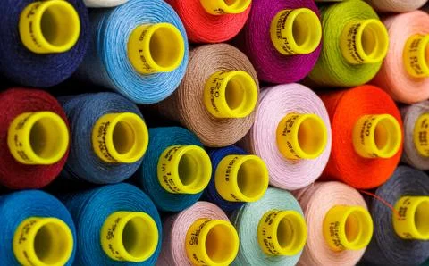 Set of multi-colored spools of thread for sewing Stock Photos