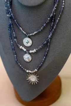 A set of multi-layered handmade necklaces with beads and pendants Stock Photos
