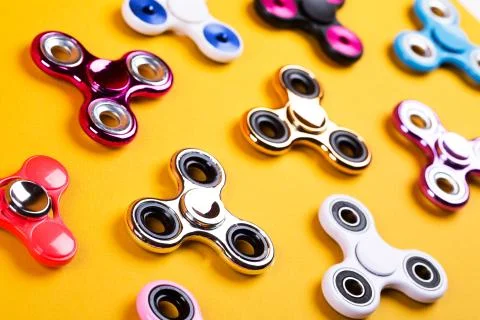 Set of multicolored fidget spinners Stock Photos
