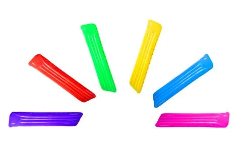 Set of multicolored inflatable floating pool raft mattress in fan order isola Stock Photos