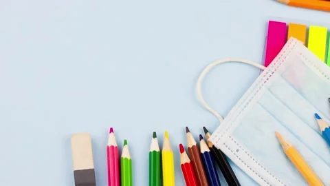 Set of multicolored pencils and school supplies lie on a pastel background with Video stock 156133760