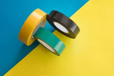 Set of multicolored rolls of electrical round adhesive sticky insulation tape Foto stock