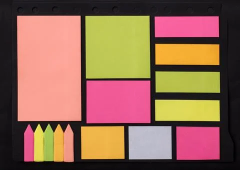 Set of multicolored stickers of different sizes on a black background Stock Photos