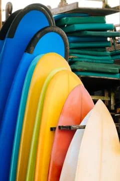 Set of multicolored surf boards in a stack by ocean.Bali.Indonesia. Surf boards Stock Photos