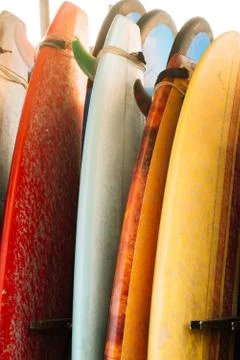 Set of multicolored surf boards in a stack by ocean.Bali.Indonesia. Surf boards Stock Photos