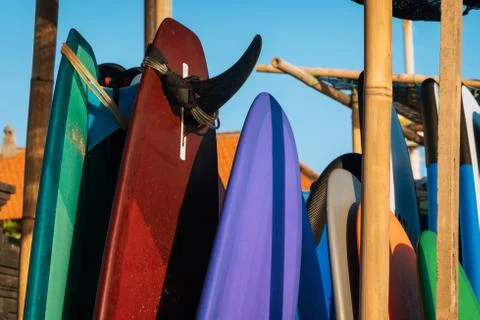 Set of multicolored surf boards in a stack by ocean.Bali.Indonesia. Surf boards 库存照片
