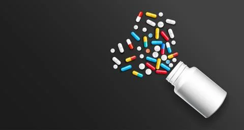 Set of multicolored tablets and assorted capsules Illustrazione stock
