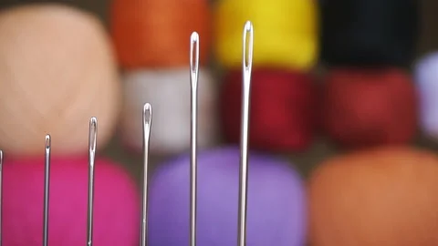 A set of needles for hand sewing on the background of colored threads Stock Footage 109182198