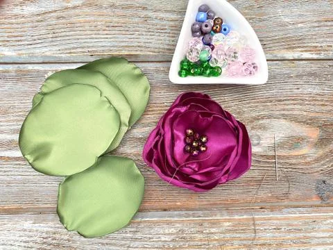 Set for needlework, make a flower from a fabric using a candle. Stock Photos