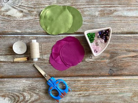 Set for needlework, make a flower from a fabric using a candle. Stock Photos