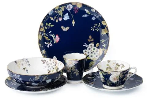 Set of new ceramic tableware with ornament isolated on white Stock Photos