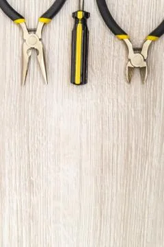 Set of new tools for the master of various applications on light wooden backg Stock Photos