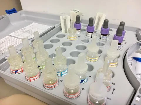 Set og bottles (tubes) with different allergens using for allergy skin test. Stock Photos