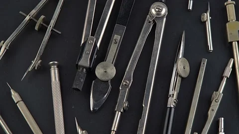 Set of old different compasses. Retro metal compasses and drafting tools on a Stock Footage 237822882