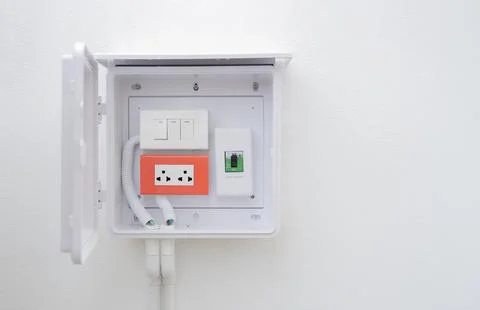Set of old electrical, socket switch installed at white wall outside home w.. Stock Photos