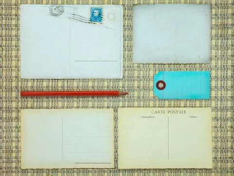 Set of old postcards, label and red pencil Фото