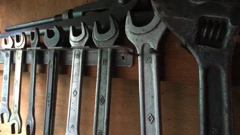 A set of old rusty tools hanging Stock Footage 138736815