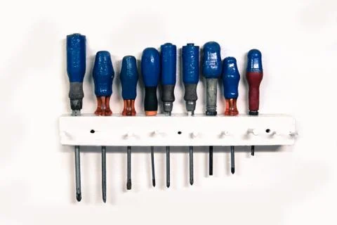 Set of old screwdriver tools on white background Stock Photos