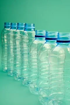 Set of open plastic bottles standing in line Stock Photos