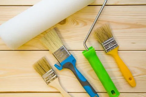 A set of paint brushes and roller for repair Stock Photos