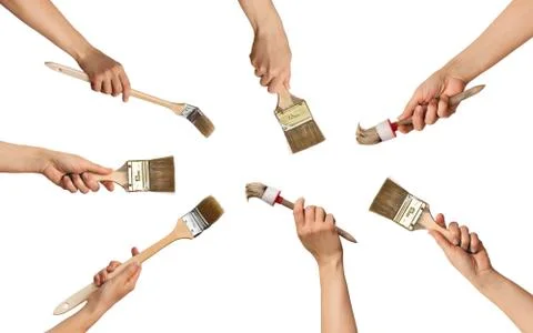 Set of paint brushes in hands in a circle Stock Photos