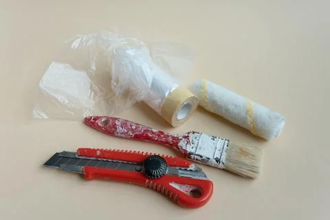 A set of painter's tools. a paint brush, a spatula and a knife for the builde Stock Photos