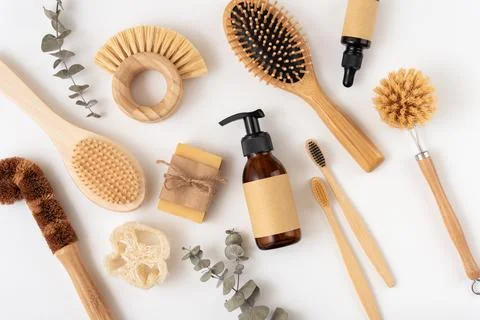 Set of personal care items including a bamboo toothbrush, soap bar, clean bru Stock Photos