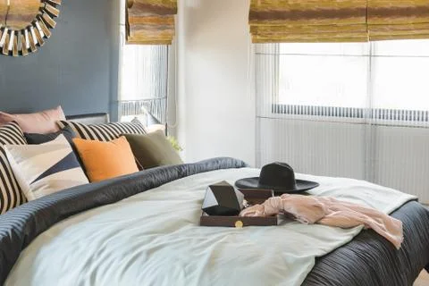 Set of pillows on bed with blanket Stock Photos