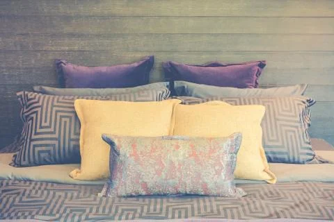 Set of pillows on bed Stock Photos