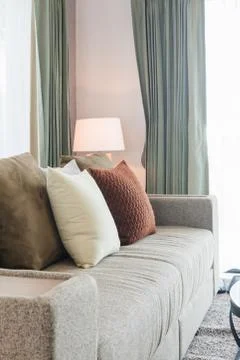 Set of pillows on classic sofa in modern living room Stock Photos