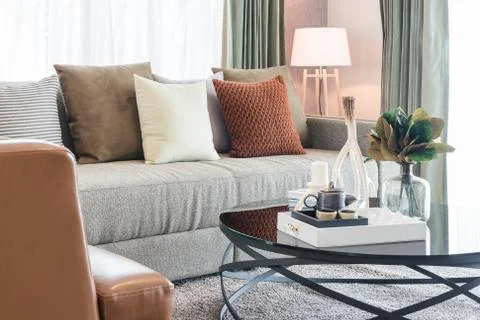 Set of pillows on classic sofa in modern living room Stock Photos