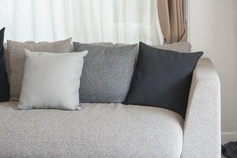 Set of pillows on modern sofa Stock Photos