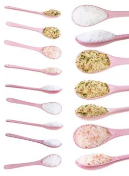 Set from pink ceramic spoon with various salts Stock Photos