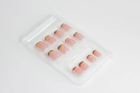 A set of pink false nails isolated on white background 스톡 사진