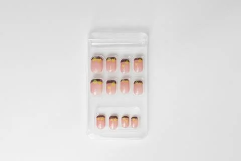 A set of pink false nails isolated on white background Foto stock