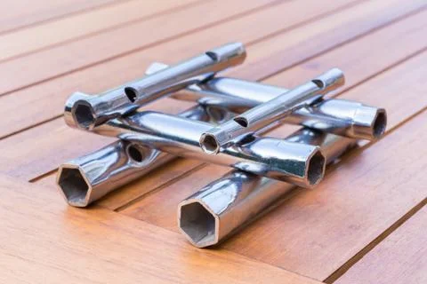 Set of pipe wrenches as construction on table Stock Photos