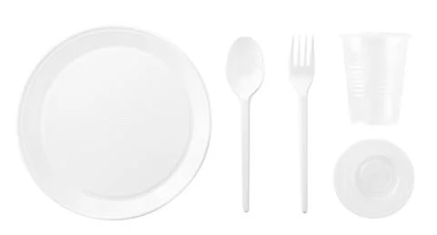 Set of plastic dishes on a white background. The view from top Stock Photos